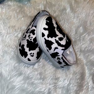 Unbranded, hand drawn toddler cow print slip on’s.